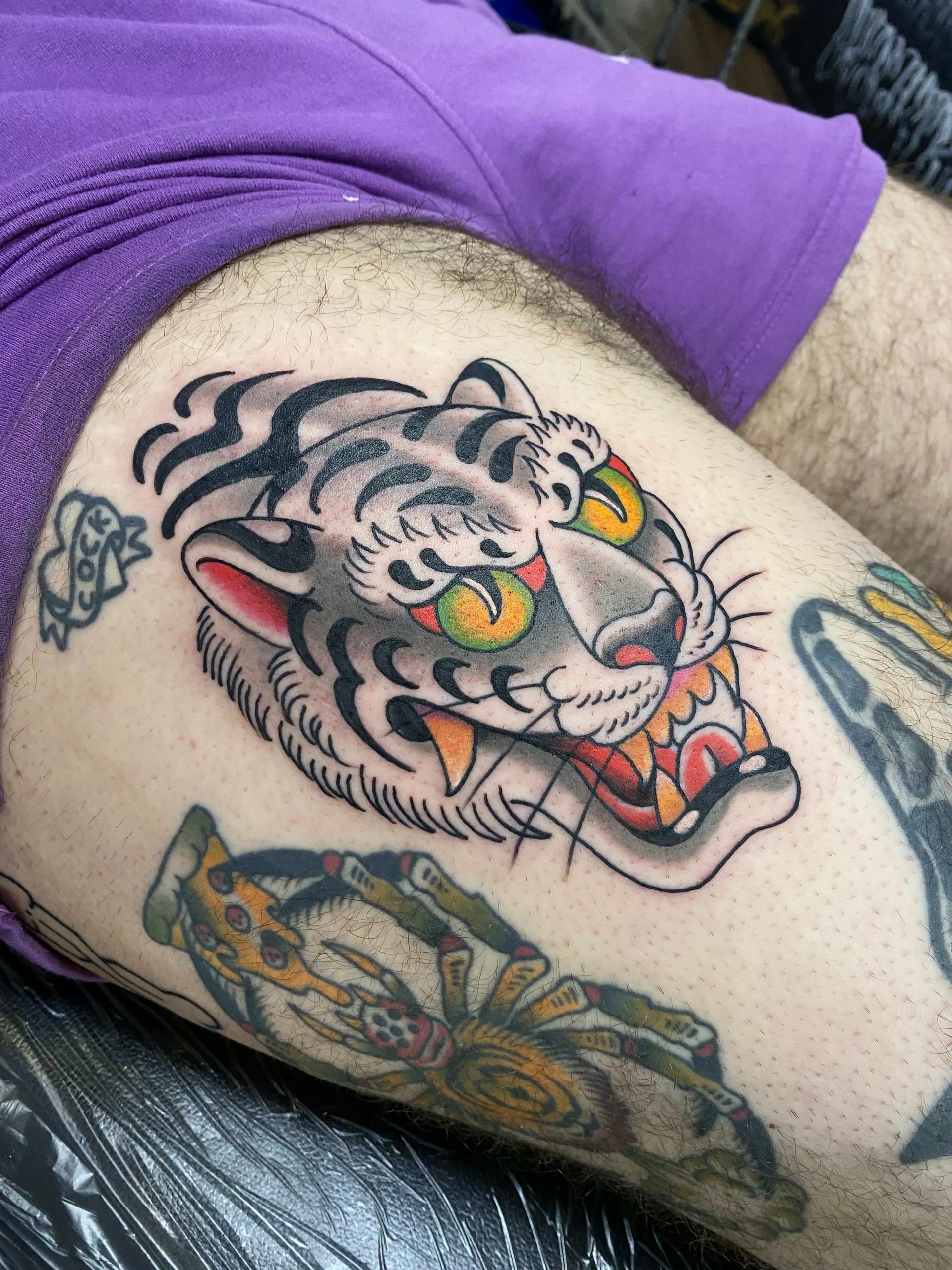 A tattoo of a pikachu and a light bulb on a person 's arm