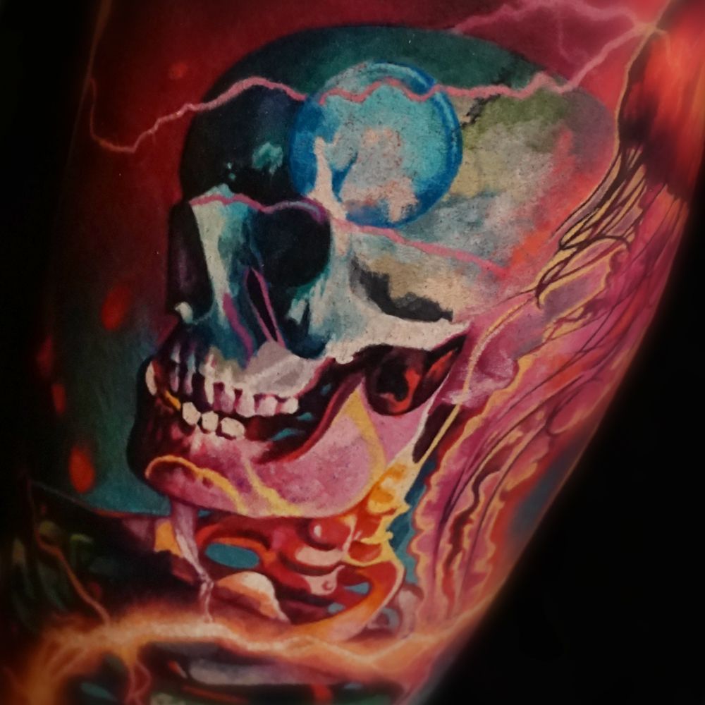 A colorful painting of a skull and skeleton