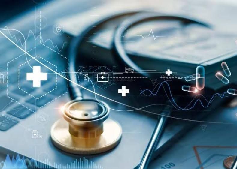 Stethoscope on a laptop, overlaid with medical data, pills, and health icons.