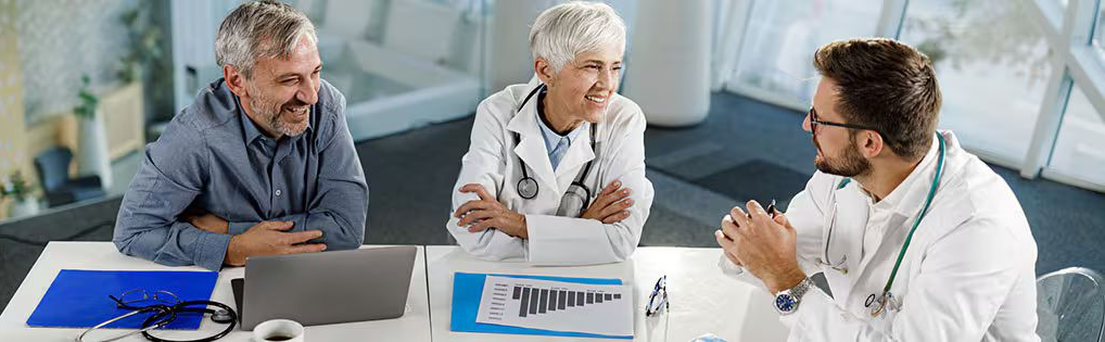 Hands typing on a laptop with blue-toned digital overlays of documents and checklists appearing on the screen.