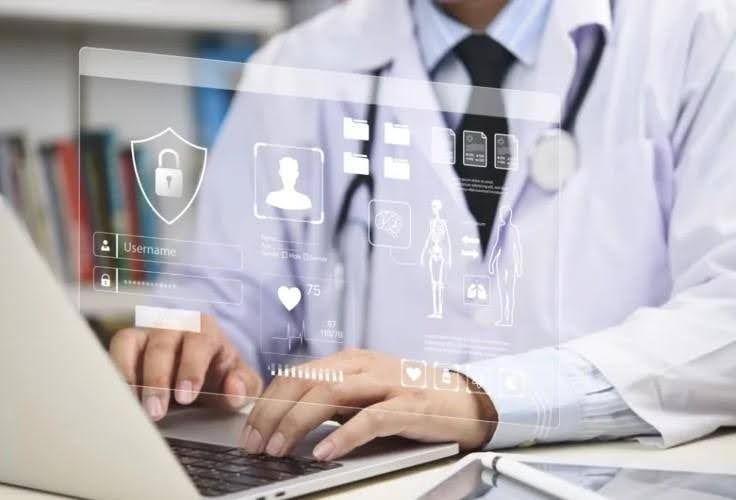 Doctor using a laptop with a digital interface showing medical data and security icons.