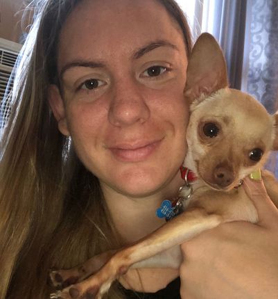 woman holding the dog