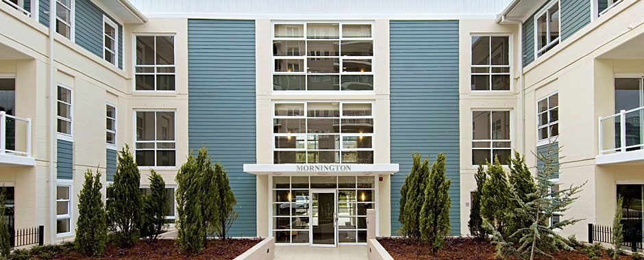 Large Apartment Building With Blue Sides And White Sliding Door And Glass Windows  — Atherton Glass In Atherton, QLD