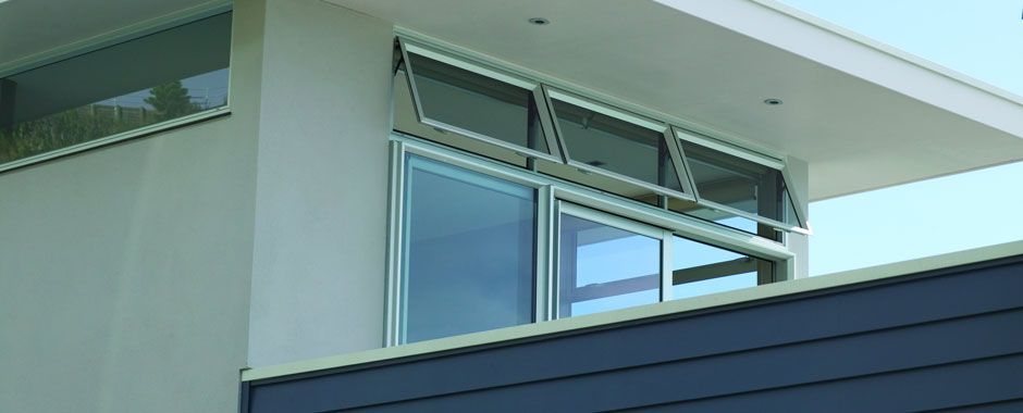 Large Window On The Side Of A Building With A Balcony — Atherton Glass In Atherton, QLD