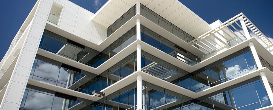 Large Building With A Lot Of Windows And Balconies — Atherton Glass In Ravenshoe, QLD