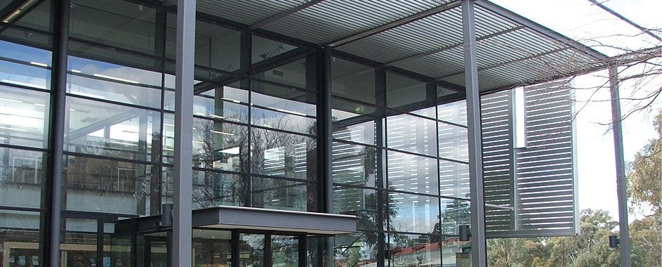 Large Glass Building With A Canopy Over The Entrance — Atherton Glass In Atherton, QLD