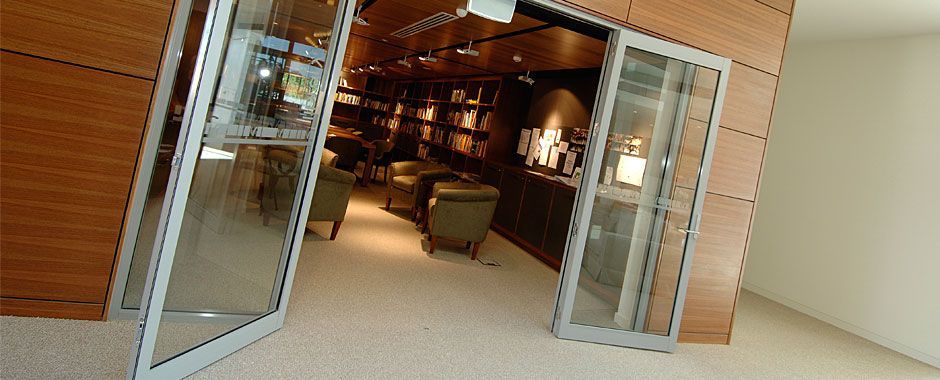 Room With A Glass Doors And A Lot Of Chairs And Tables Inside — Atherton Glass In Yungaburra, QLD