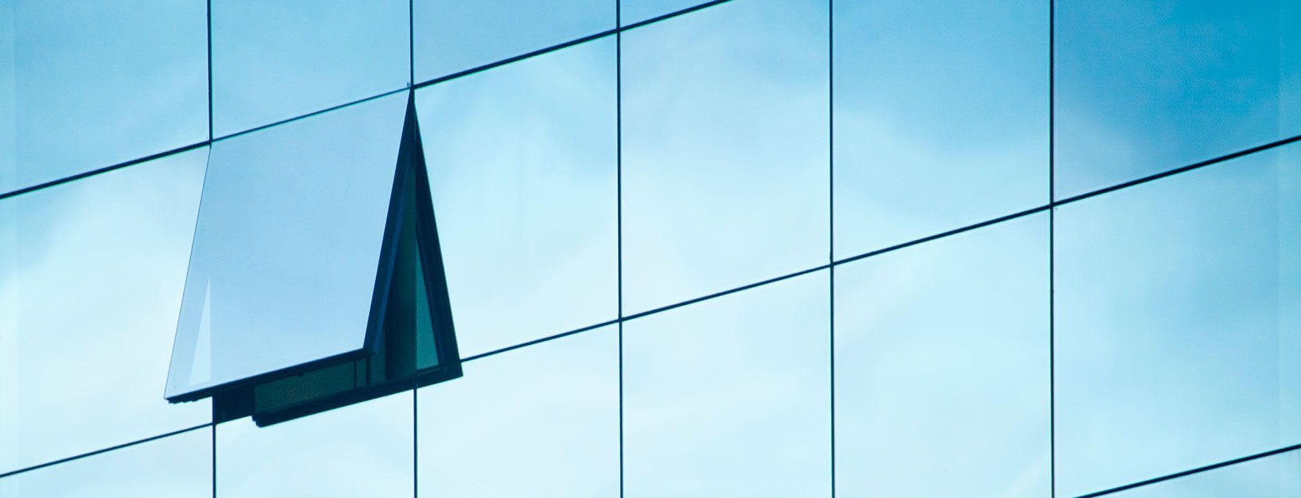 Window On The Side Of A Building With A Blue Sky In The Background — Atherton Glass In Yungaburra, QLD