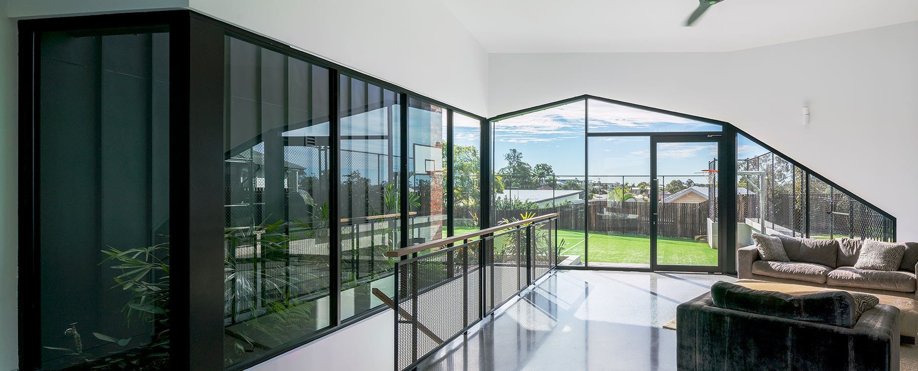 Living Room With A Lot Of Windows And A Couch — Atherton Glass In Atherton, QLD