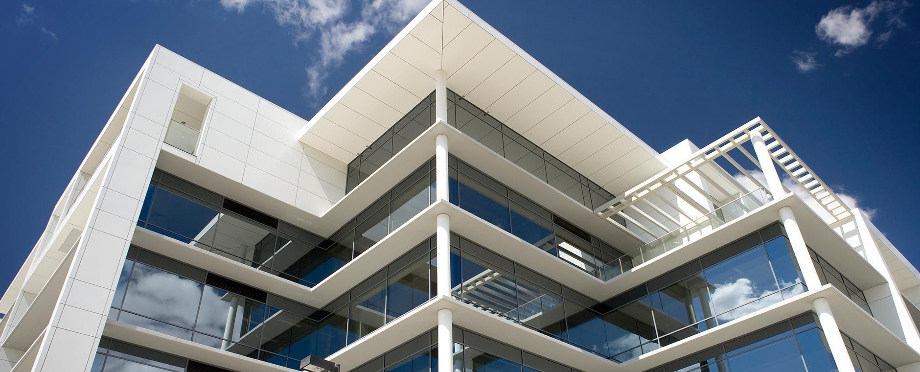 Tall Building With A Blue Sky In The Background — Atherton Glass In Atherton, QLD