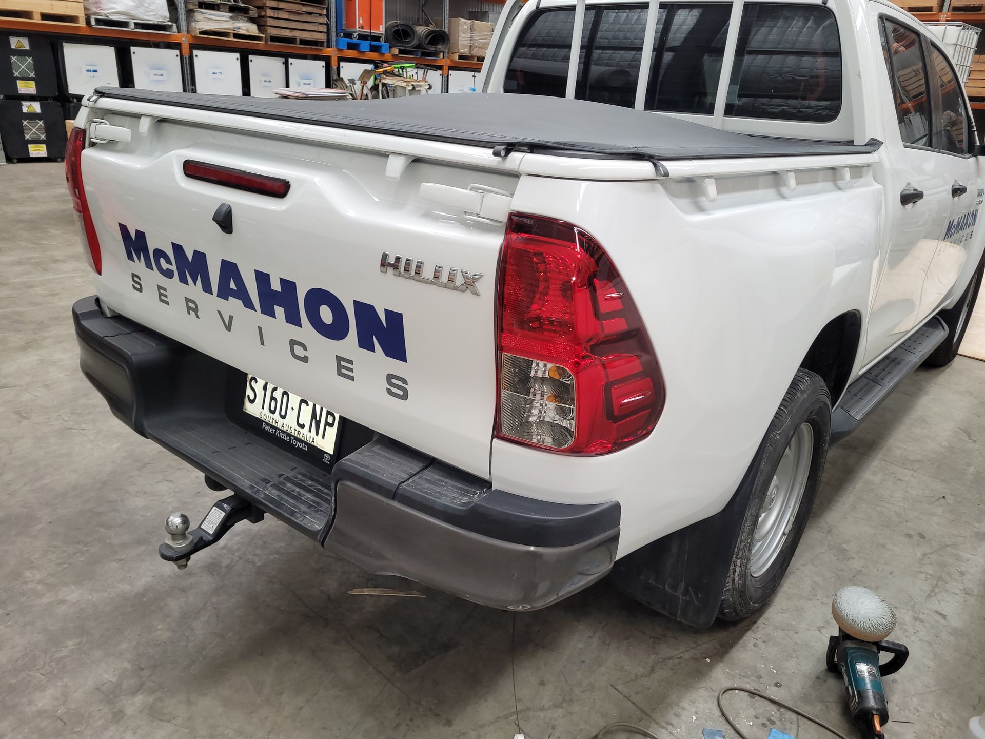A white truck with the word mcmahon on the back