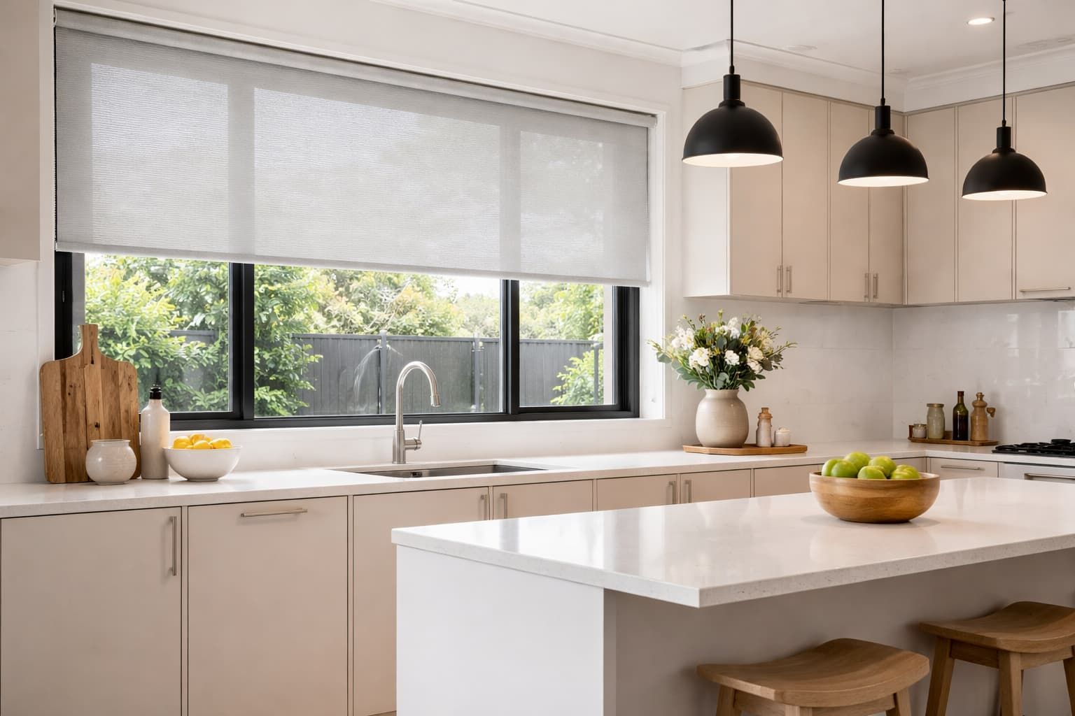 Roller blinds installed in modern kitchen window