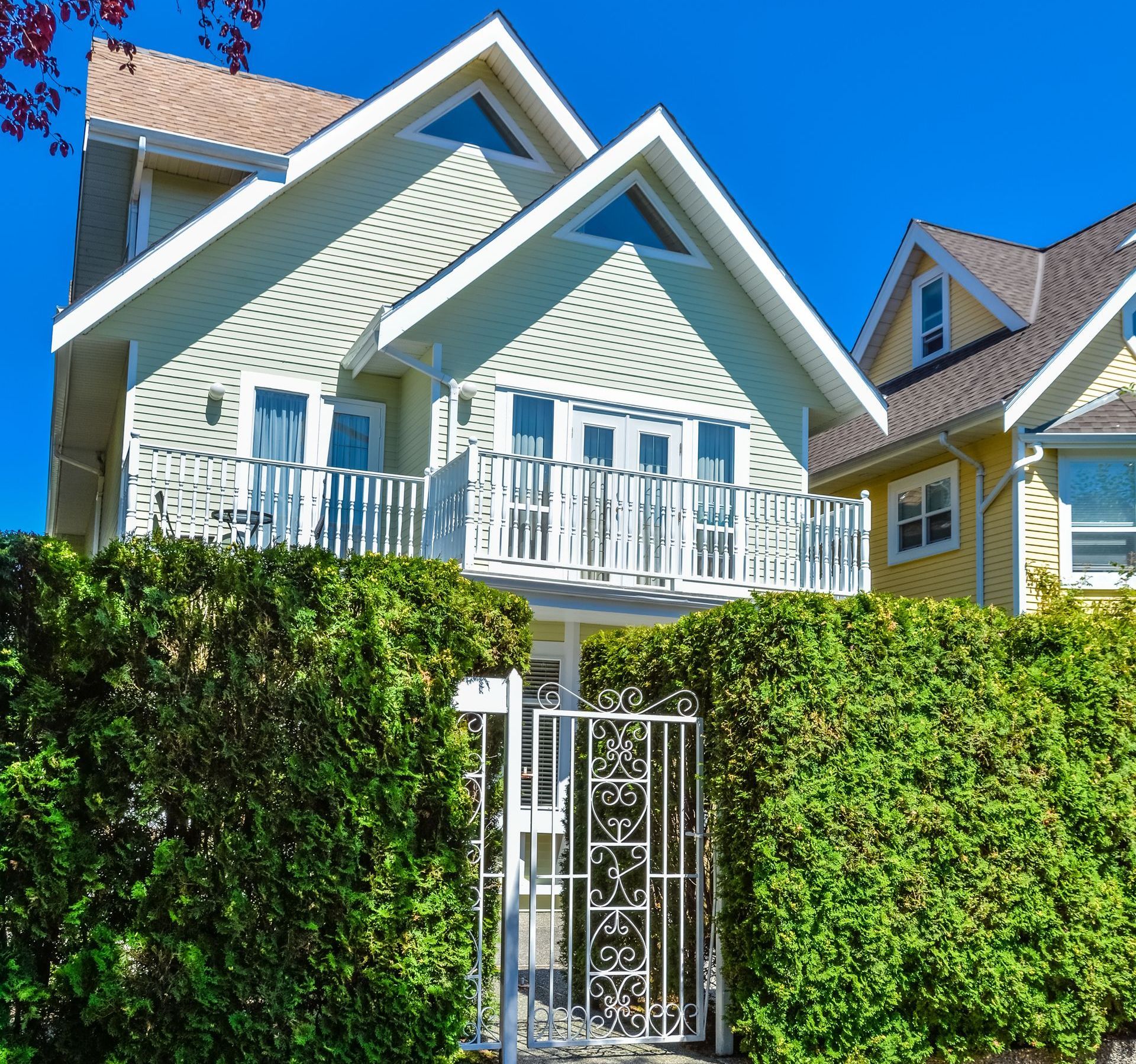 A house with a balcony and a fence around it