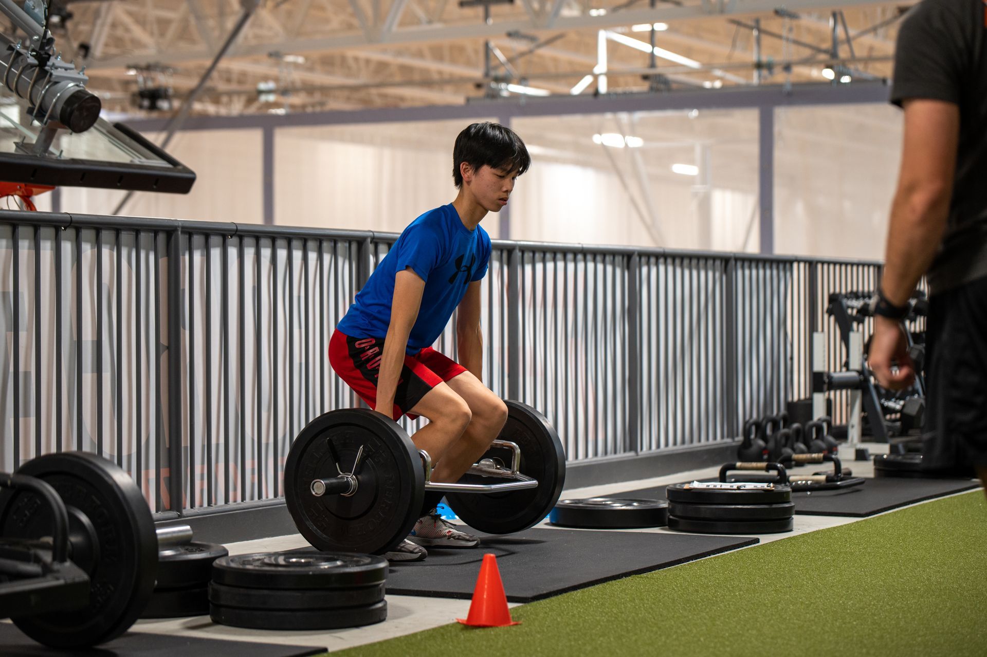 A volleyball player wearing a purple jersey with the number 6 on it