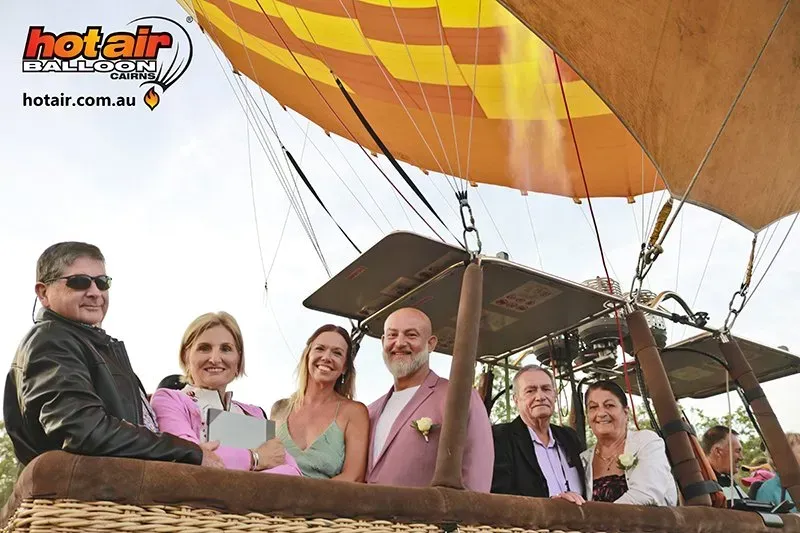 A Group of People Are Sitting in a Hot Air Balloon — GinaS Cairns Tropical Weddings in Parramatta Park, QLD