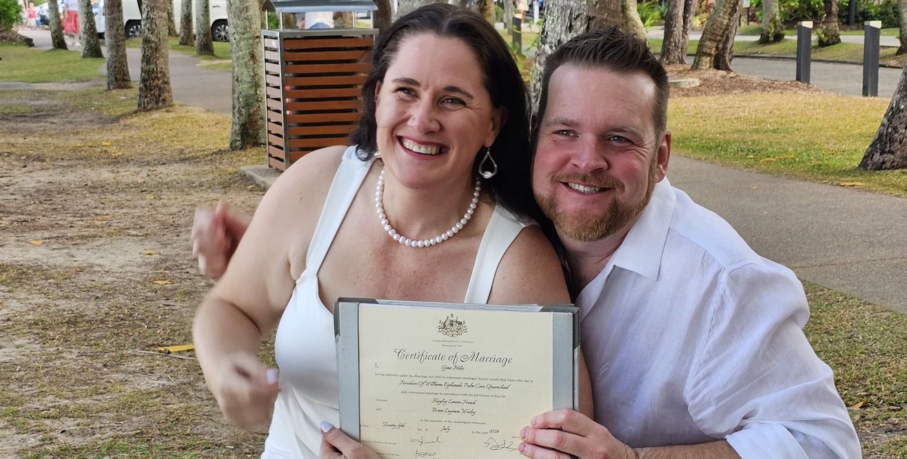 A Bride and Groom Are Holding Hands During Their Wedding Ceremony — GinaS Cairns Tropical Weddings in Parramatta Park, QLD