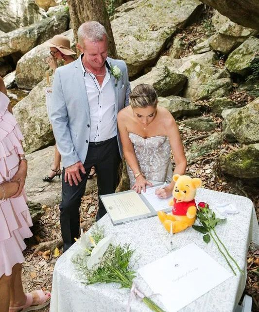 A Bride and Groom Are Signing a Wedding Certificate — GinaS Cairns Tropical Weddings in Parramatta Park, QLD