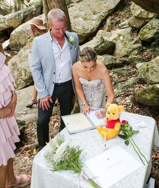 A Bride and Groom Are Signing Their Wedding Papers — GinaS Cairns Tropical Weddings in Palm Cove, QLD