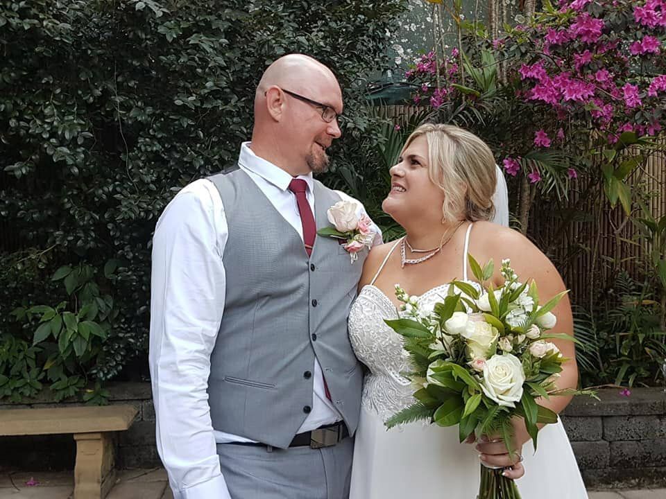 A Bride and Groom Are Posing for a Picture on Their Wedding Day — GinaS Cairns Tropical Weddings in Parramatta Park, QLD