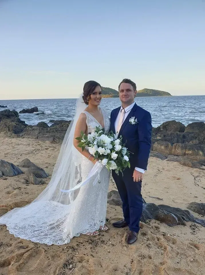 A Bride and Groom Are Posing for a Picture on the Beach — GinaS Cairns Tropical Weddings in Parramatta Park, QLD