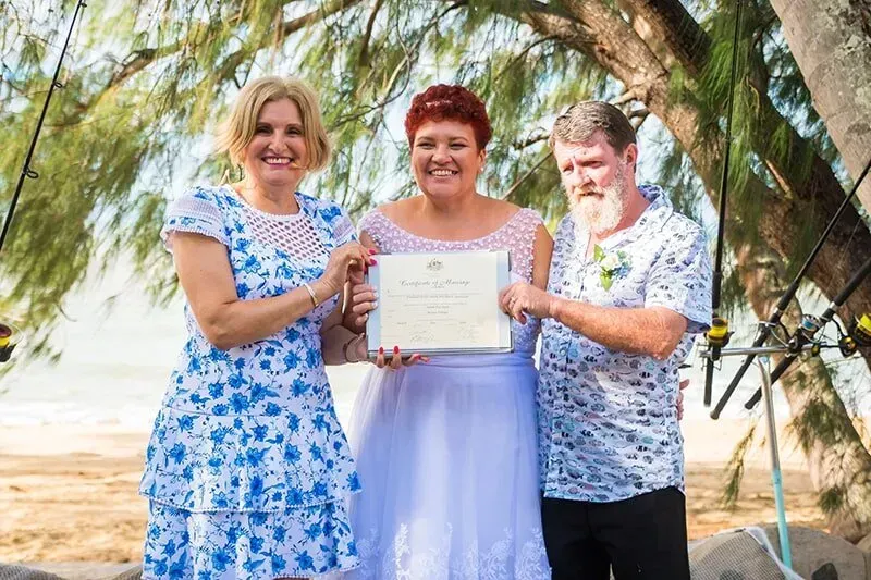 A Group of People Standing Next to Each Other Holding a Certificate — GinaS Cairns Tropical Weddings in Parramatta Park, QLD