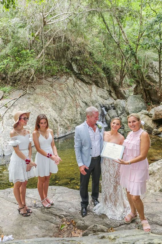 A Bride and Groom Are Posing for a Picture With Their Wedding — GinaS Cairns Tropical Weddings in Parramatta Park, QLD