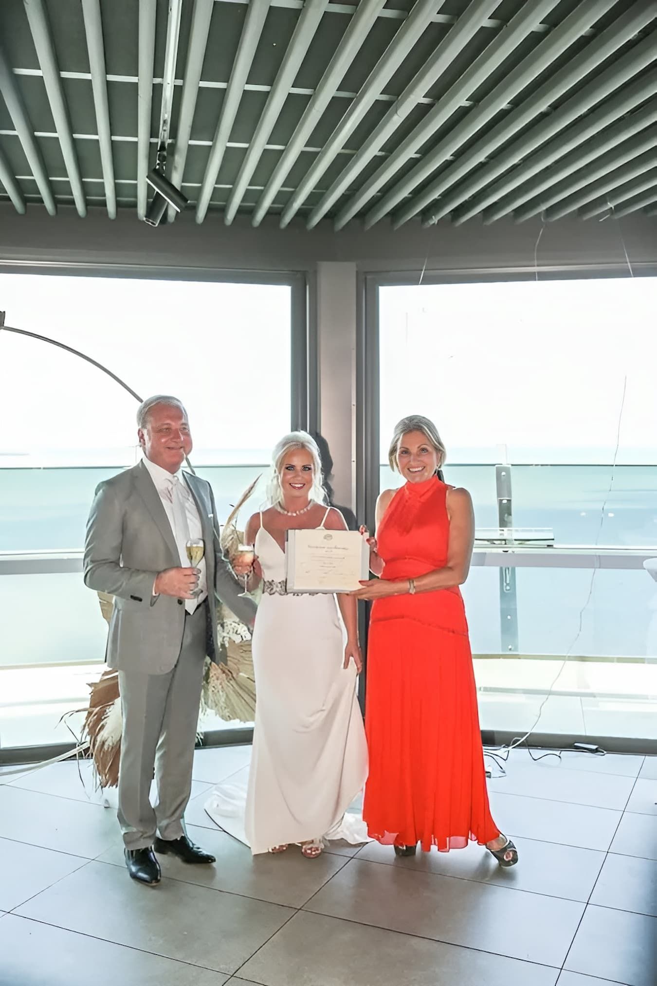 A Bride and Groom Are Posing for a Picture With Their Parents — GinaS Cairns Tropical Weddings in Parramatta Park, QLD