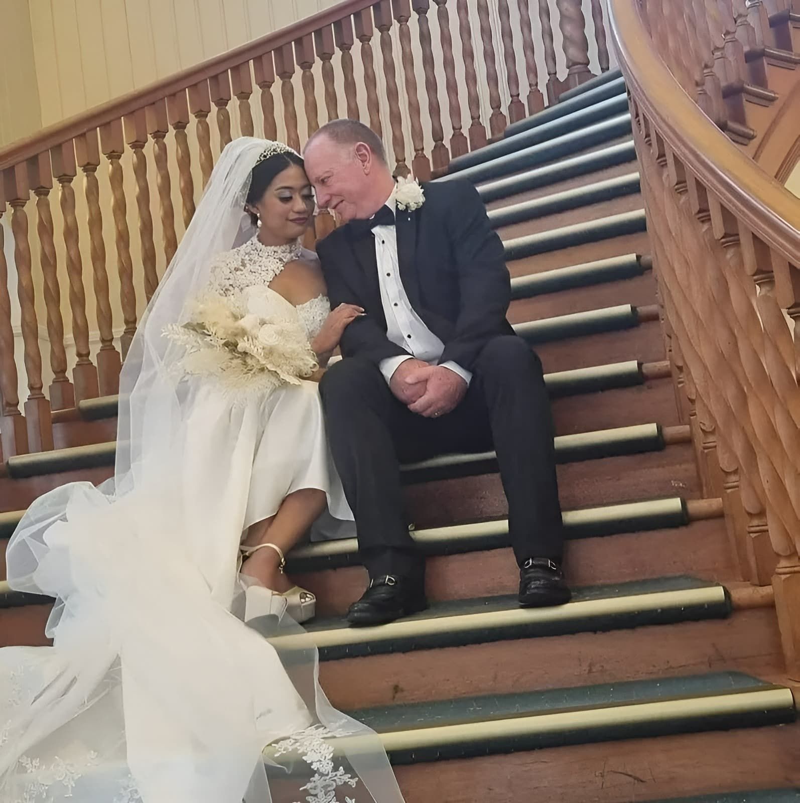 A Bride and Groom Are Sitting on a Set of Stairs — GinaS Cairns Tropical Weddings in Parramatta Park, QLD