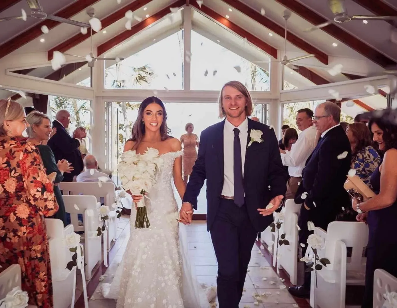 A Bride and Groom Are Walking Down the Aisle of a Church — GinaS Cairns Tropical Weddings in Parramatta Park, QLD
