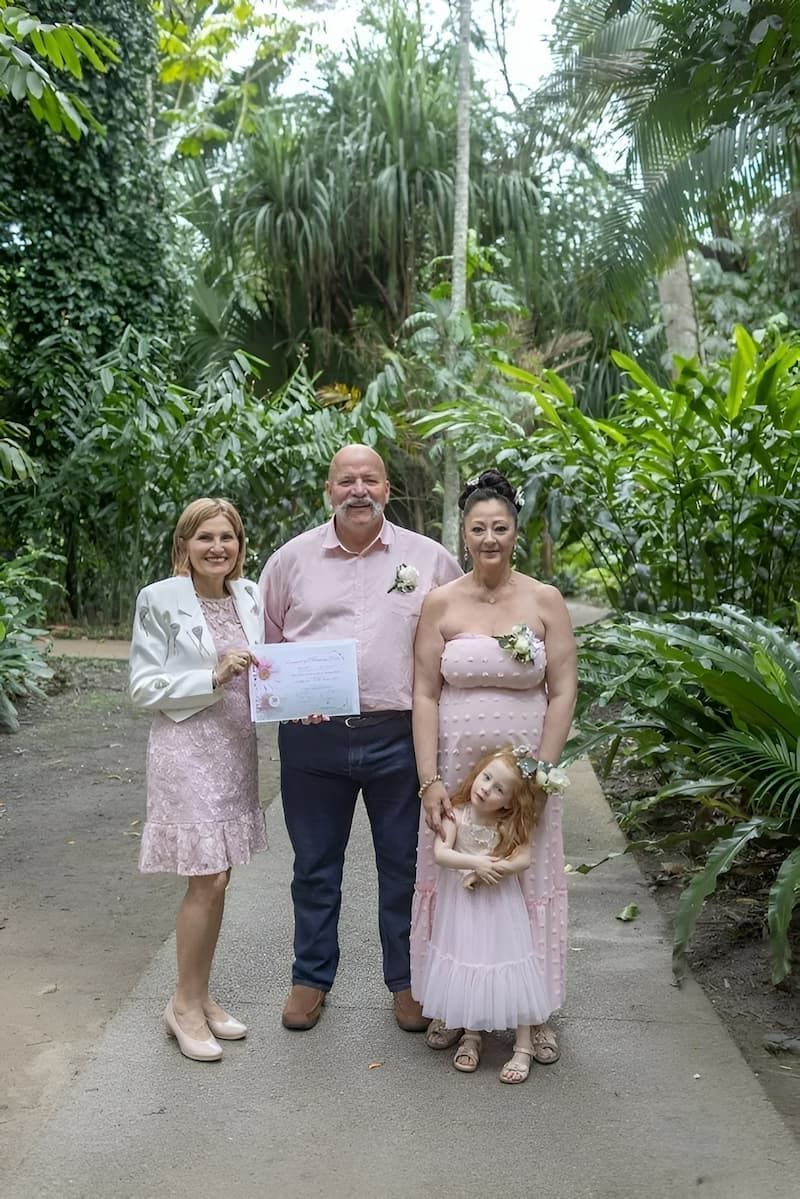 A Group of People Standing Next to Each Other in a Park — GinaS Cairns Tropical Weddings in Parramatta Park, QLD