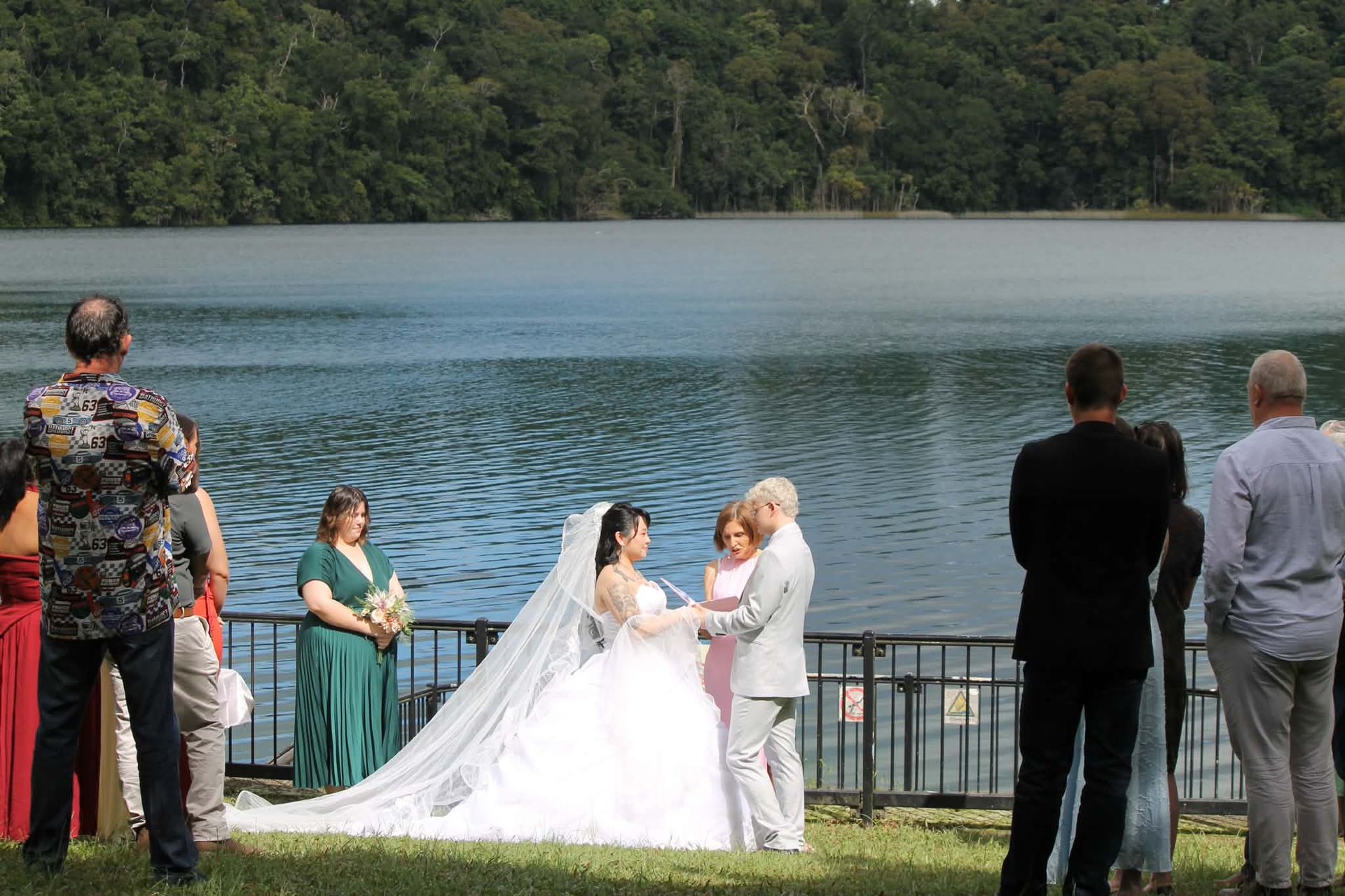 Bride and groom in white at a lakeside wedding — GinaS Cairns Tropical Weddings in Parramatta Park, QLD
