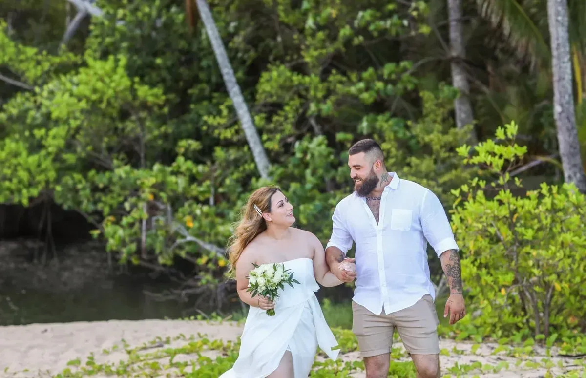 A Bride and Groom Are Walking on the Beach Holding Hands — GinaS Cairns Tropical Weddings in Parramatta Park, QLD