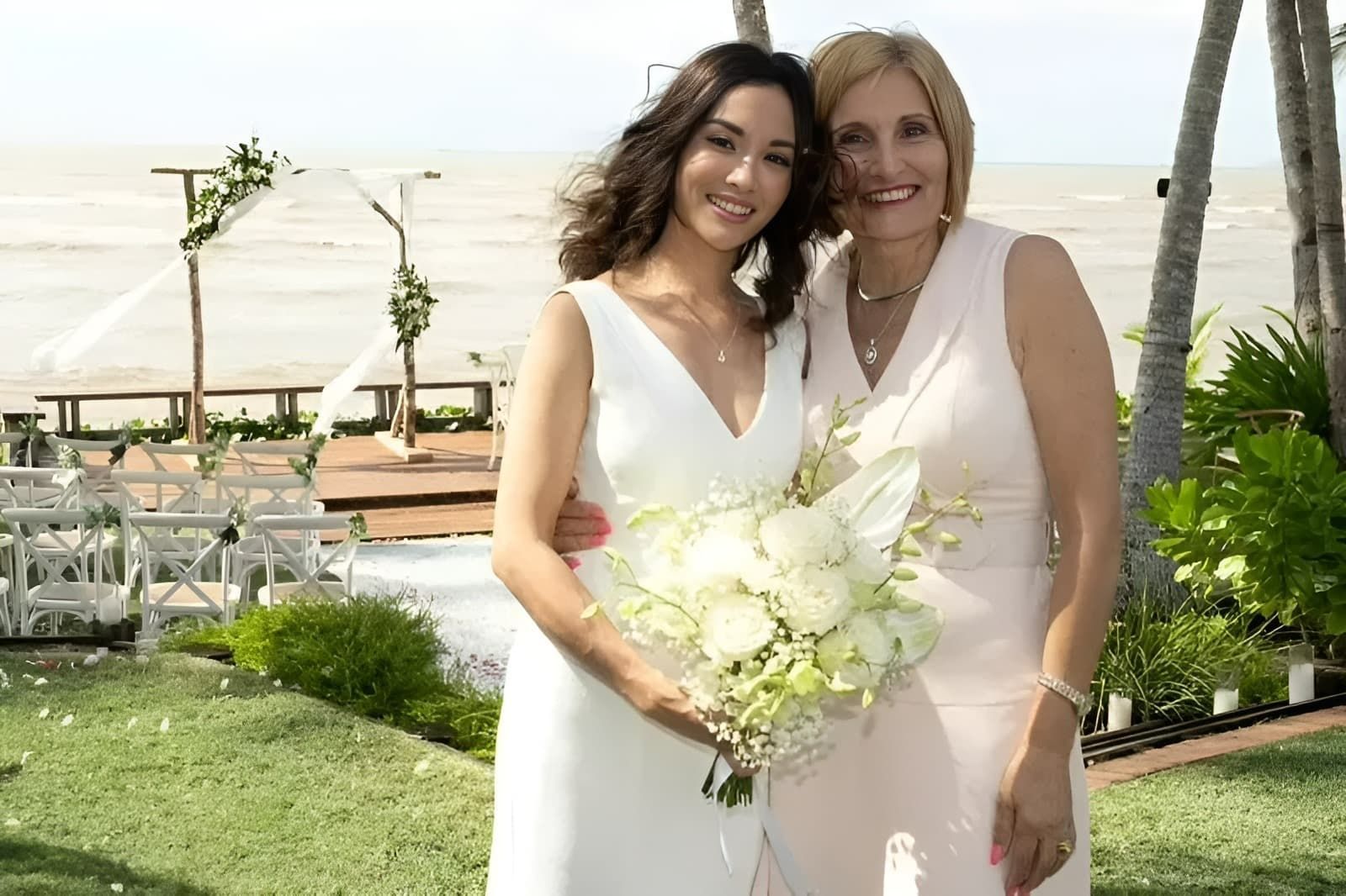 A Bride Are Posing for a Picture in Front of the Ocean — GinaS Cairns Tropical Weddings in Parramatta Park, QLD