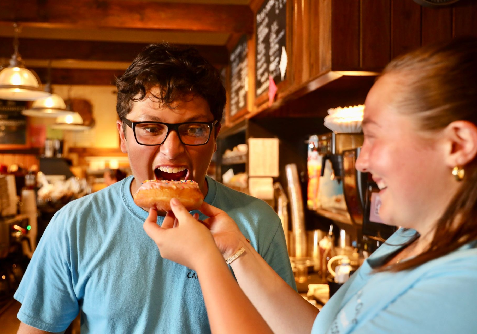 Person bites donut 