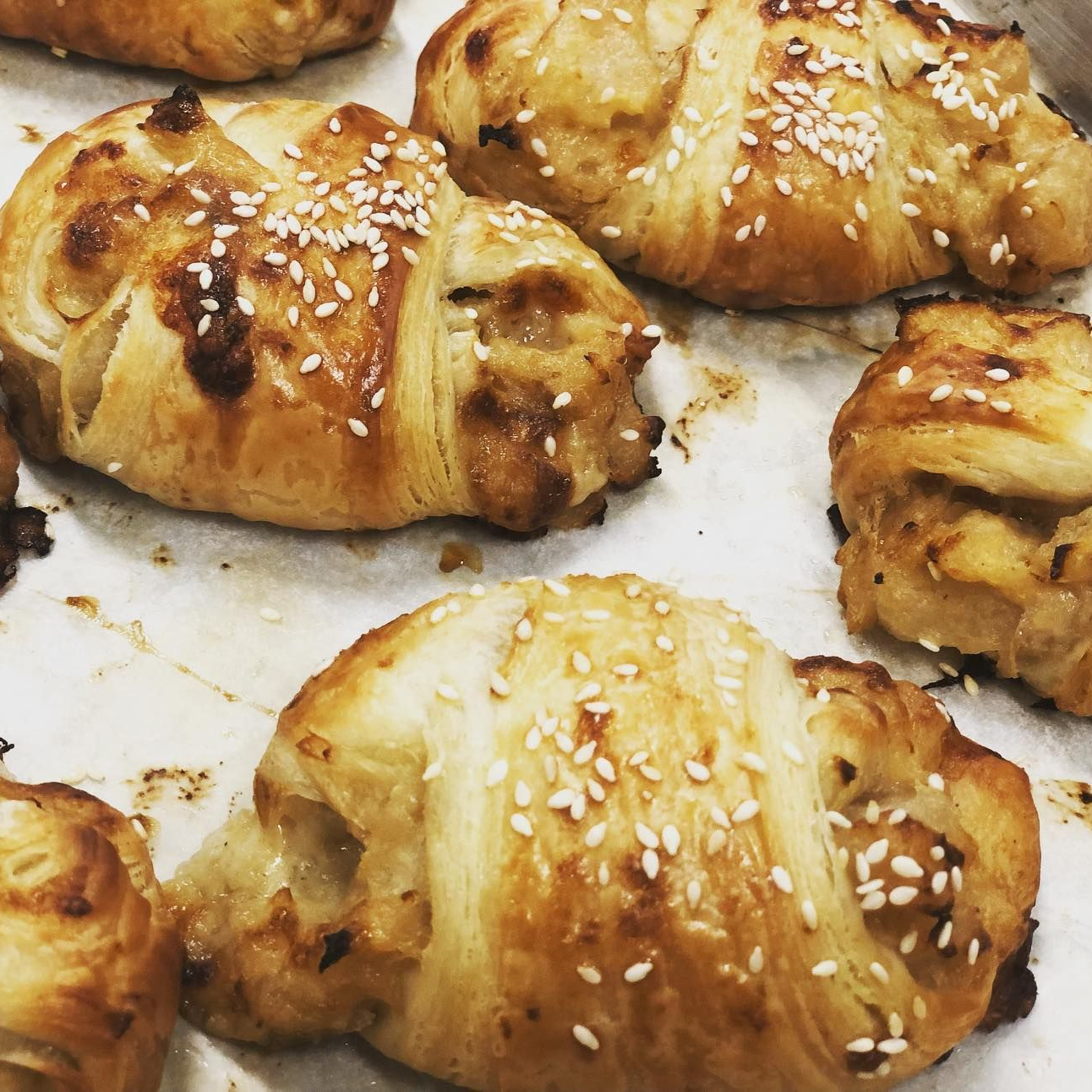 Baked pastries topped with sesame seeds 