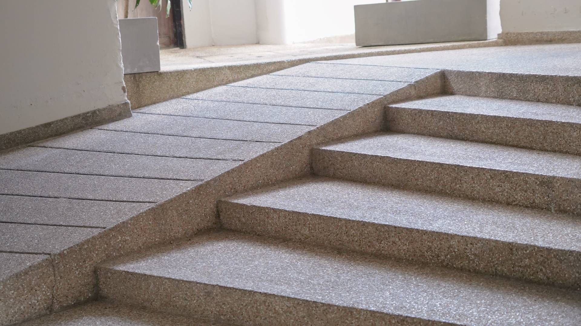There is a ramp between the stairs and the ramp.
