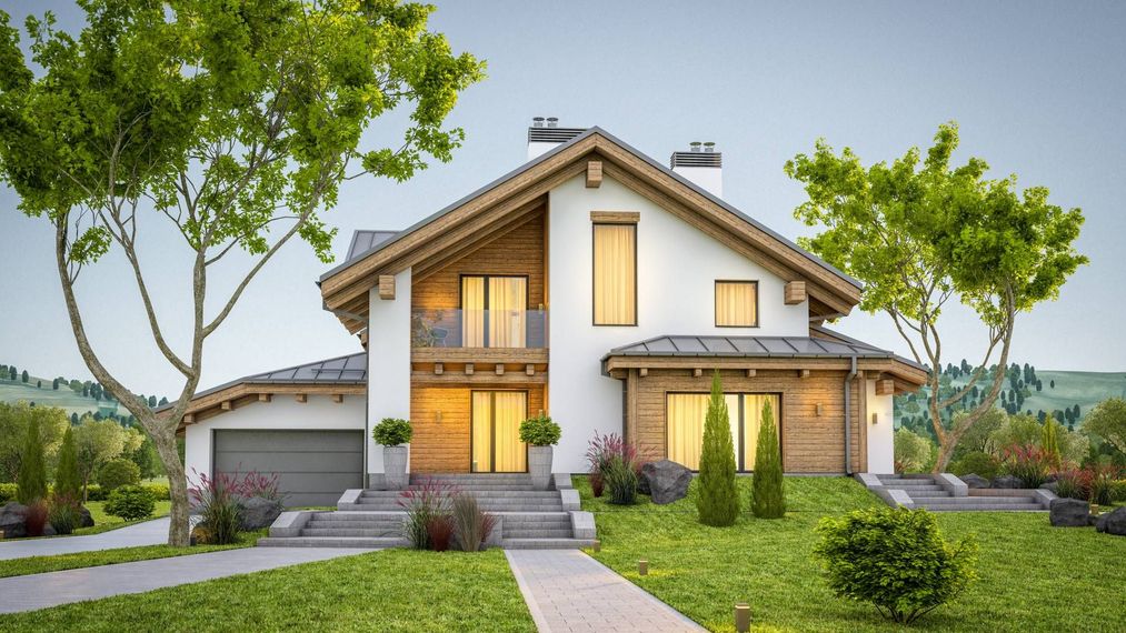 A large house with a lot of windows and trees in front of it.