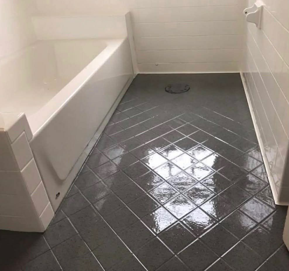 Image of a bathroom that is getting a bathtub reglazing job done. 