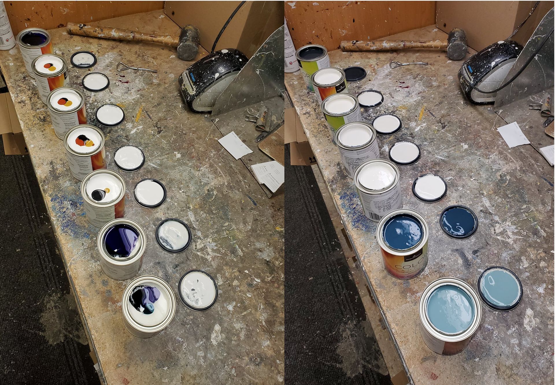A row of paint cans are lined up on a wooden table.