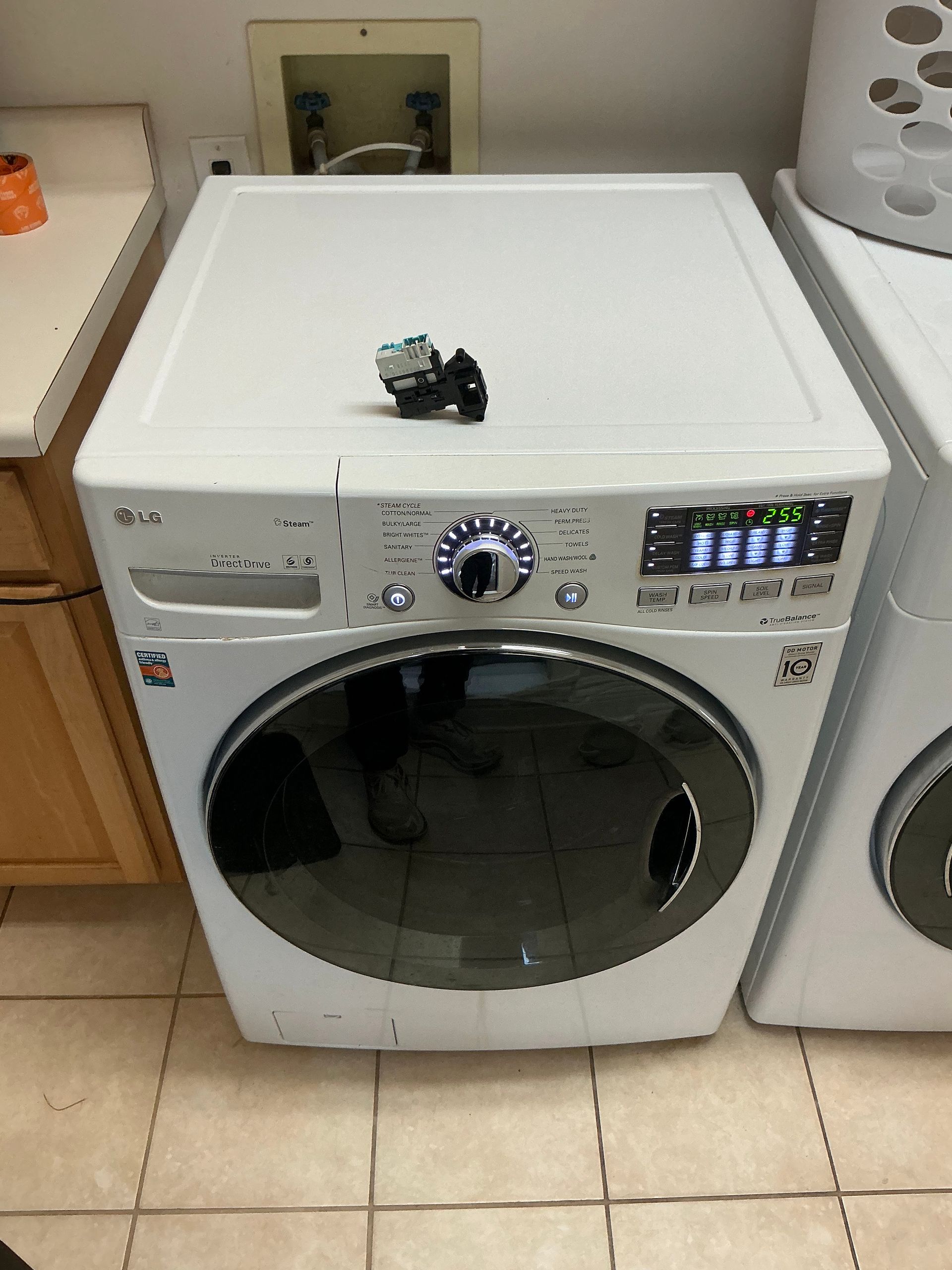 A white lg washer and dryer in a laundry room