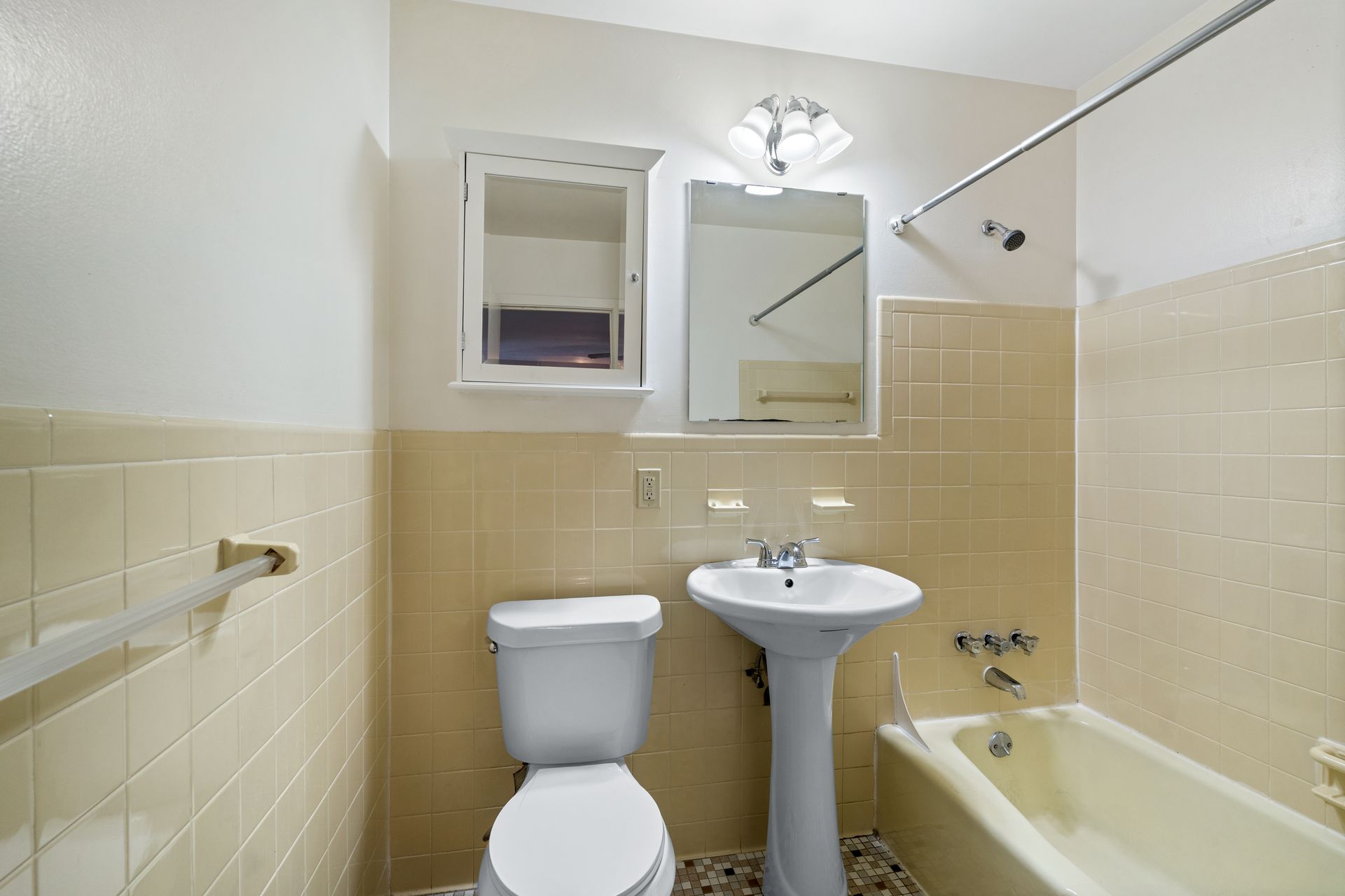 Photo of a bathroom with a bathtub/shower combo