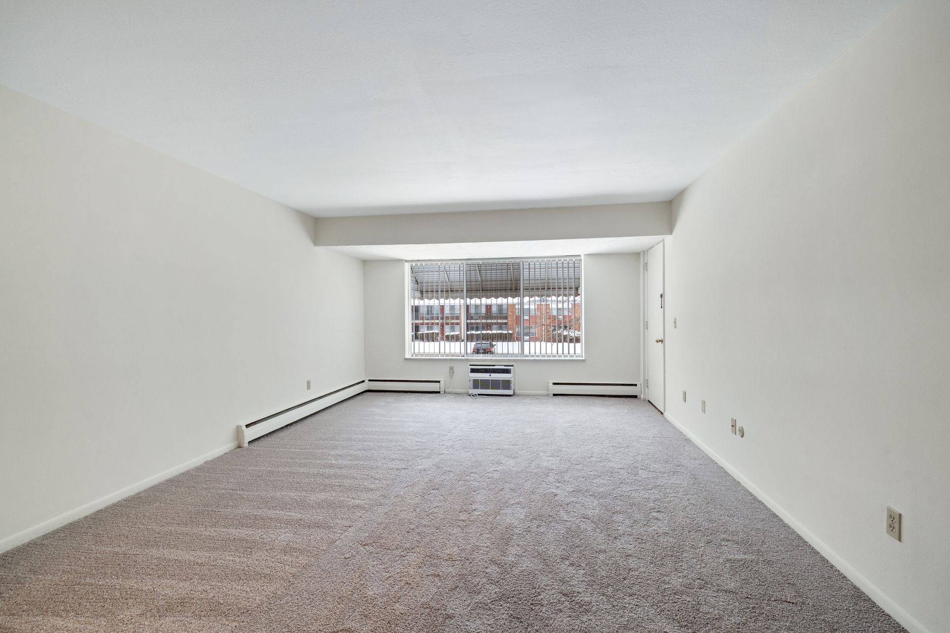 Photo of a large living room, showing an open layout