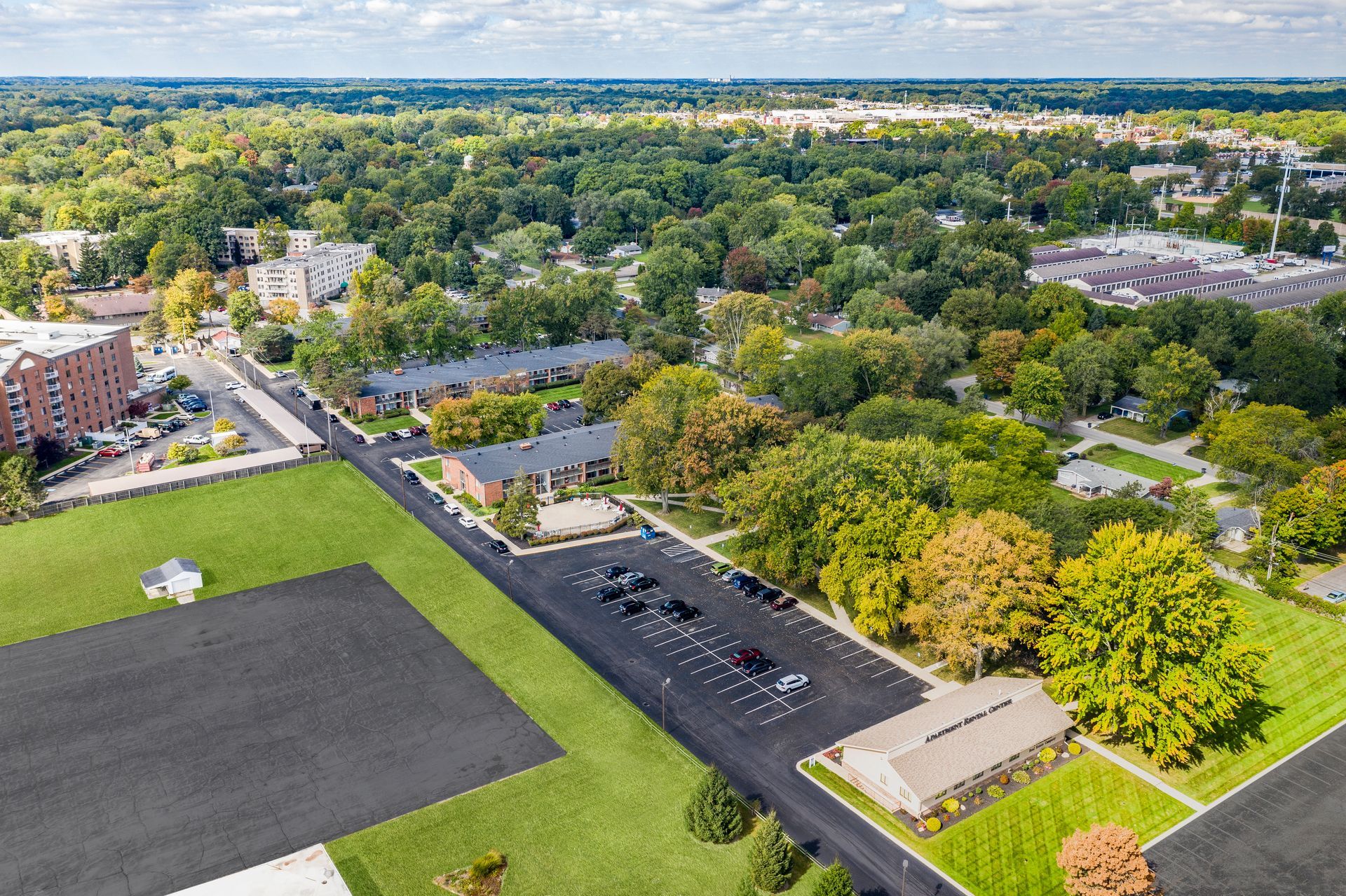 Photo of a bird's eye view of the community and surrounding area, showing plenty of plant life in the area