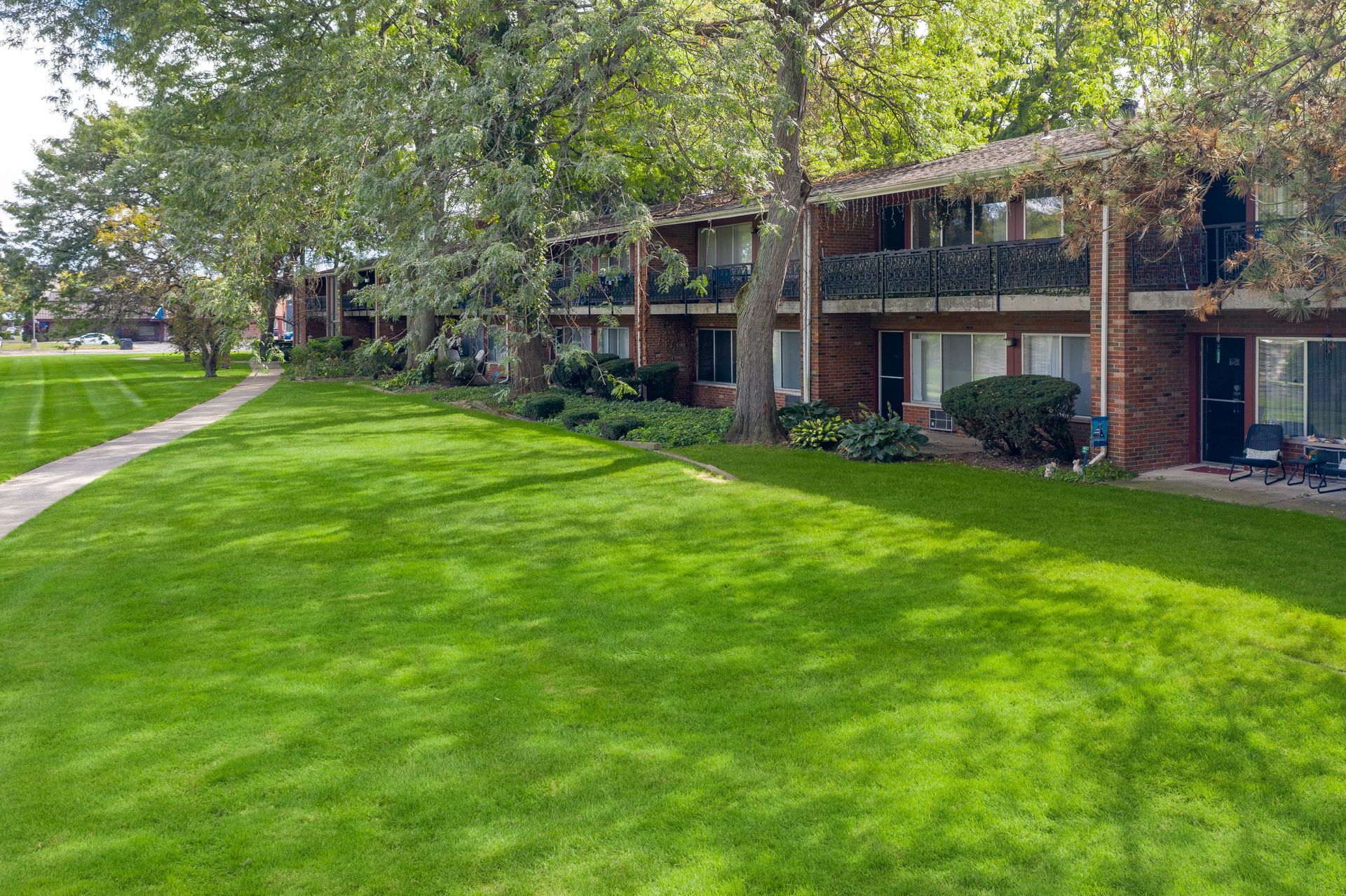Photo of a building with a large lawn in front of it