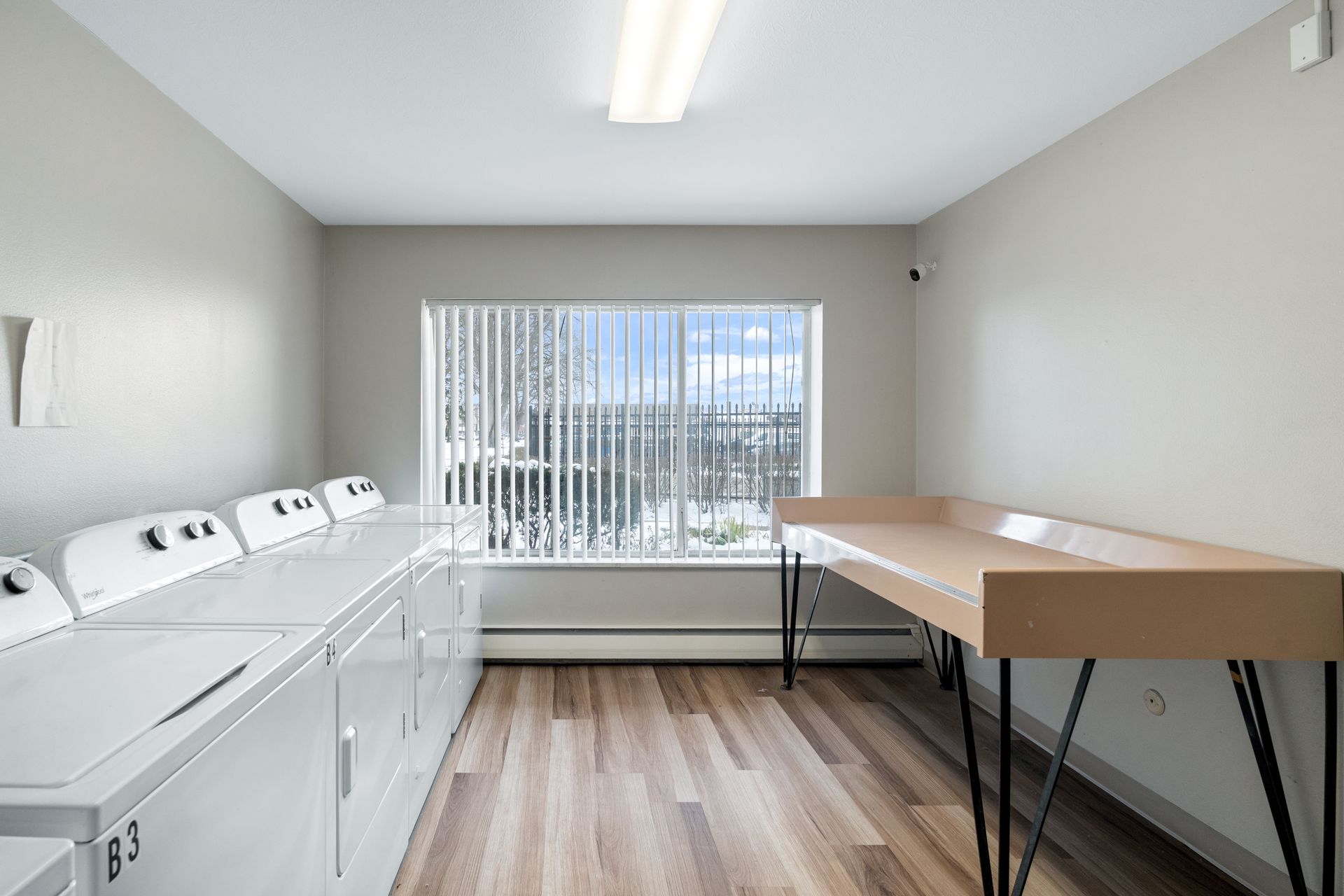 Photo of a laundry room with a folding table