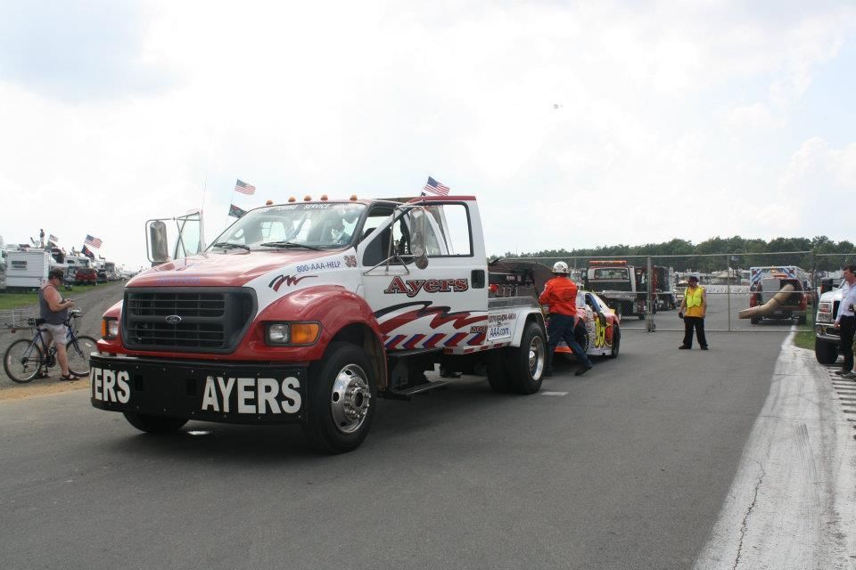 A tow truck that says ayers on the side of it