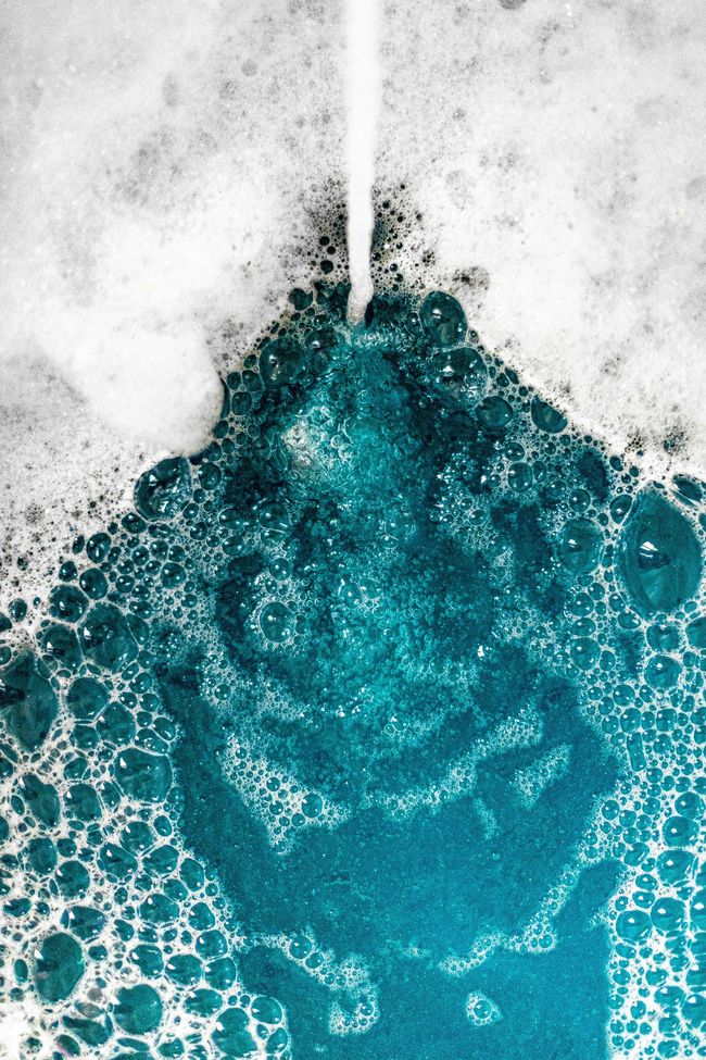A stream of water is coming out of a faucet