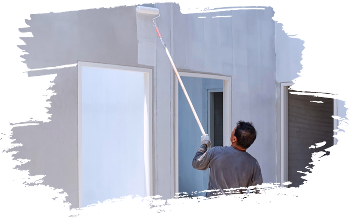 A man is painting a wall with a paint roller.