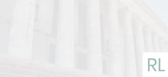 A row of white columns in front of a building.