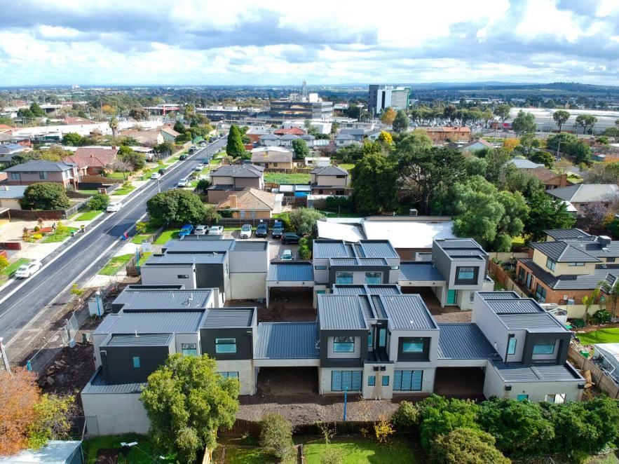 An Aerial View of a Residential Area With Lots of Houses and Trees — Accurate Fitout Solutions In Wetherill Park, NSW
